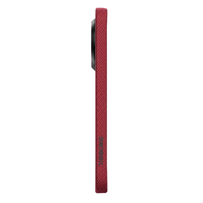 Side edge view of crimson Pixel 11 aramid case with vertical Thinborne logo. Fine grid woven texture, ultra thin border design, comfortable grip.