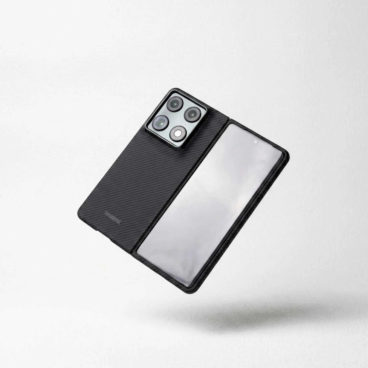 Motorola Razr Fold carbon fiber case in open unfolded position, black twill weave shell, open hinge design, floating minimalist white background product photography