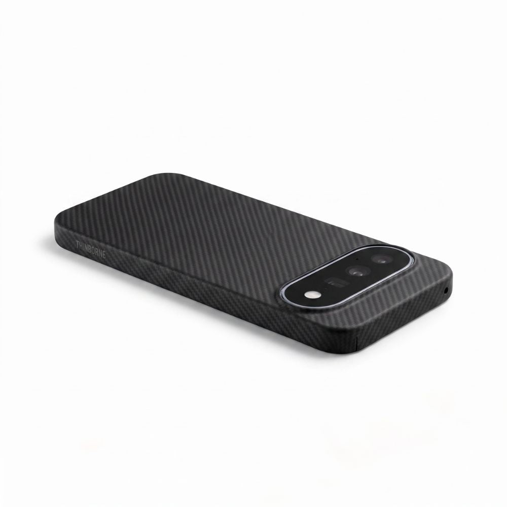 Thin lightweight black aramid fiber Pixel 11 case, angled studio product shot with brand mark