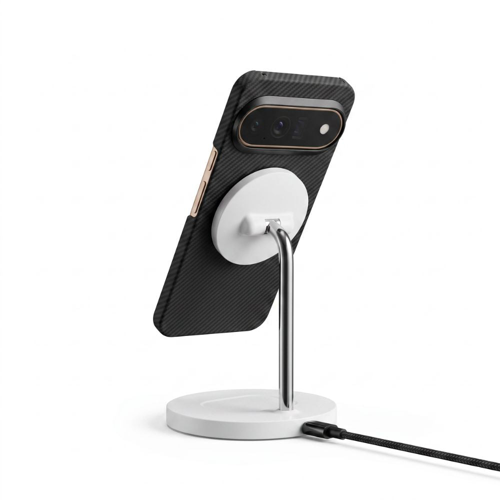 Black aramid fiber Pixel 11 Pro case attached to magnetic charging stand, slim carbon‑fiber textured protective cover