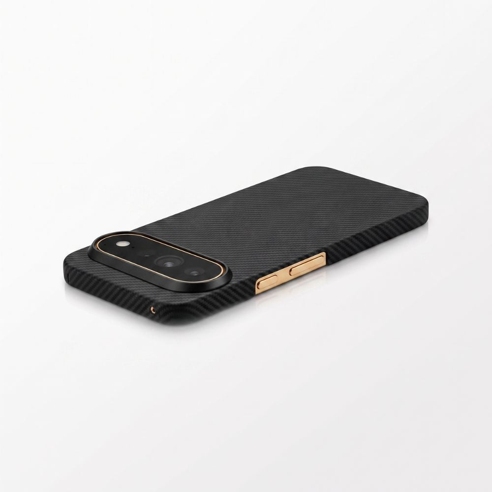 45‑degree studio shot of black aramid fiber Pixel 11 Pro slim case with gold metallic buttons