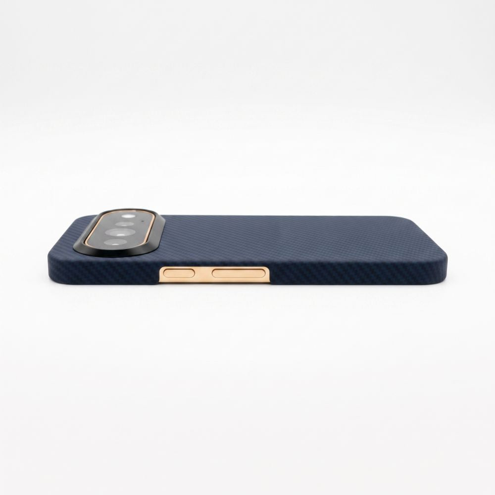 Horizontal side profile view of navy Pixel 11 Pro aramid fiber case, showcasing gold metallic power and volume buttons