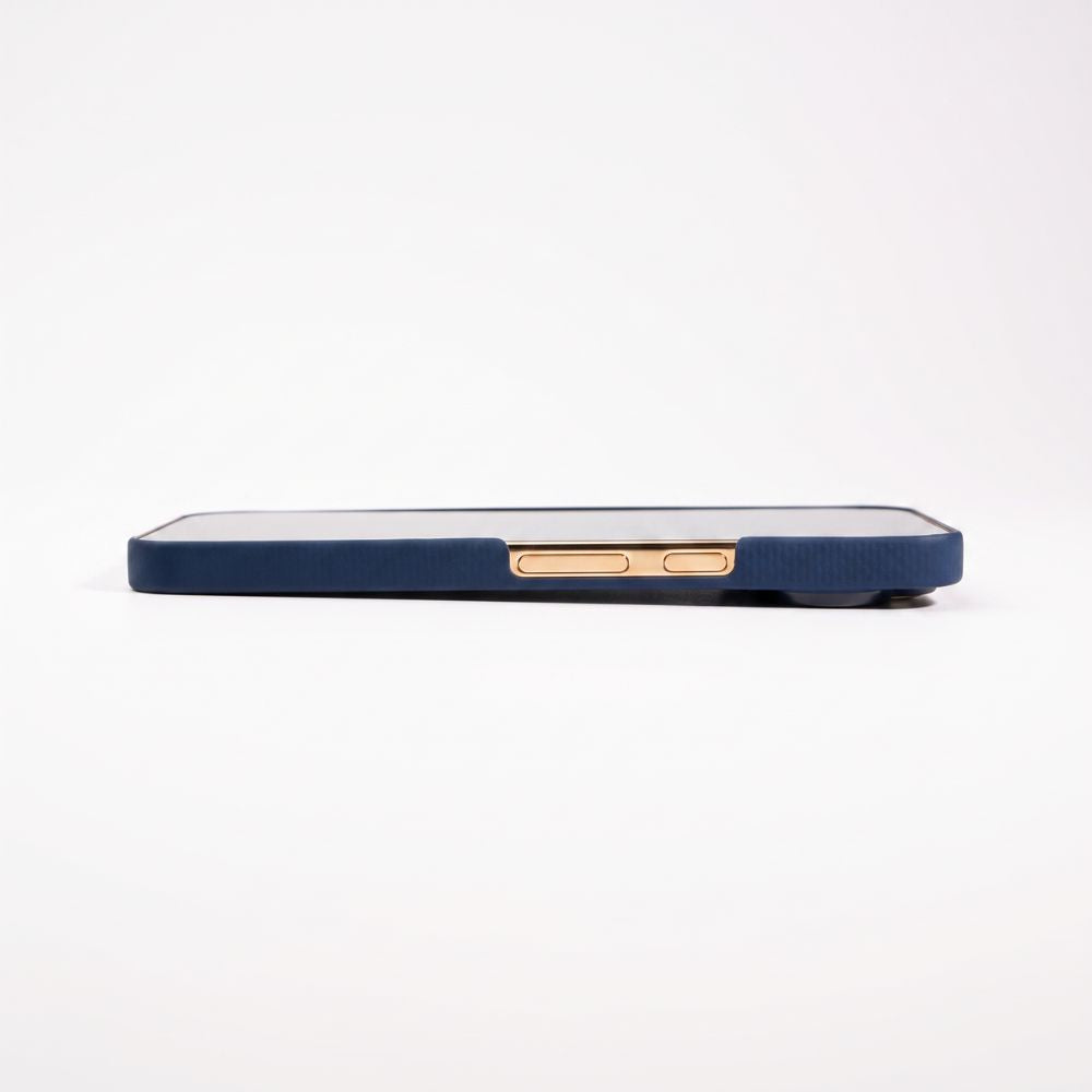 Edge profile shot demonstrating slim profile of navy Pixel 11 Pro aramid fiber case with gold accent buttons