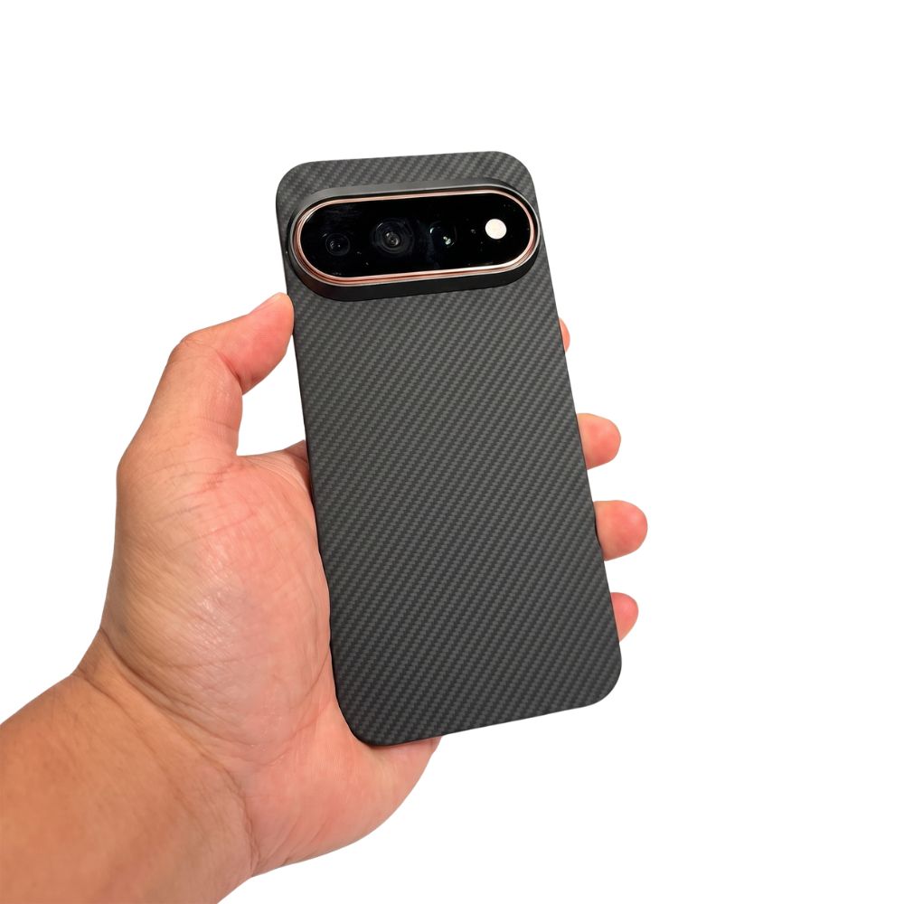 Hand holding black aramid fiber Pixel 11 Pro XL case, slim textured protective phone shell