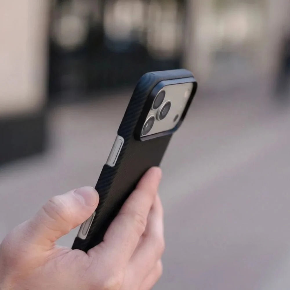 Close-up shot, hand holding Thinborne iPhone 18 Pro Max Case, raised camera frame protection