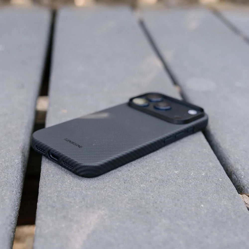 Side outdoor shot of Thinborne iPhone 18 Pro Max aramid fiber case, precise cutouts