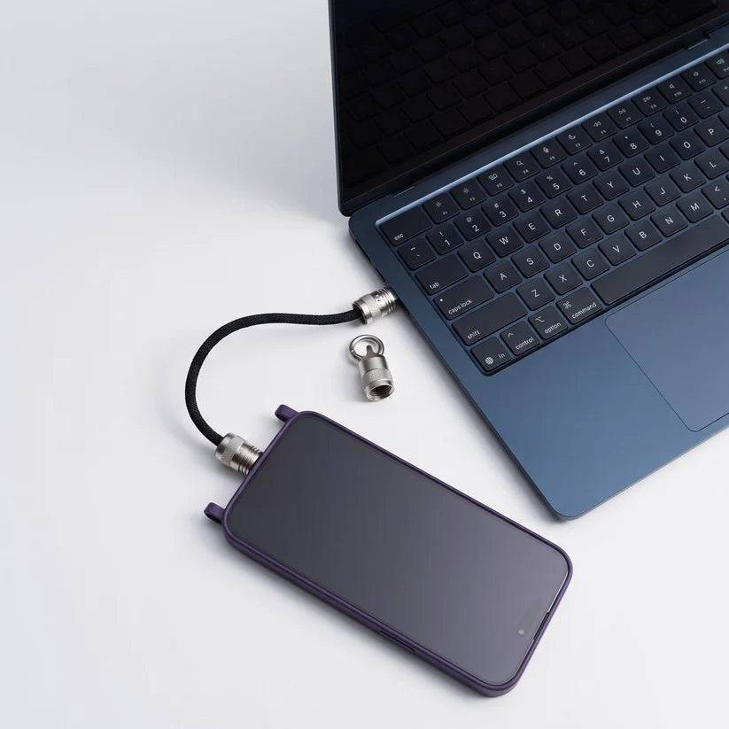 Ultra Short Keychain Cable charging smartphone connected to laptop, compact portable charging cable