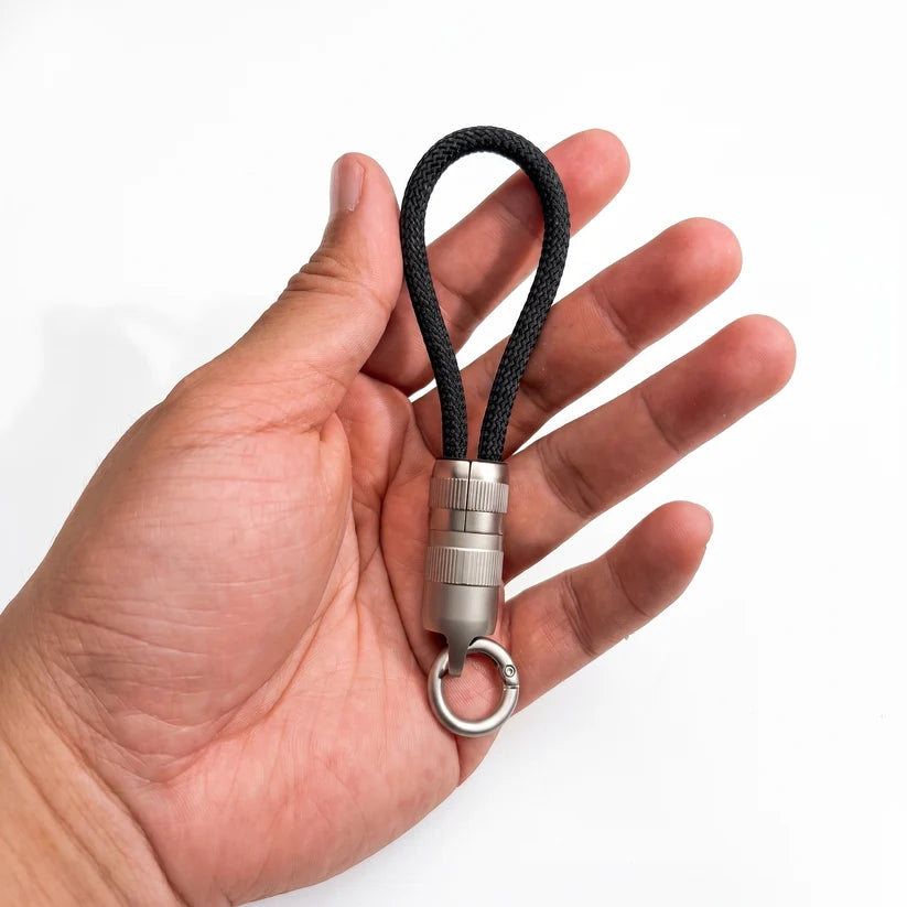 Ultra Short Keychain Cable resting on palm, demonstrate ultra compact size of portable charging keychain cable