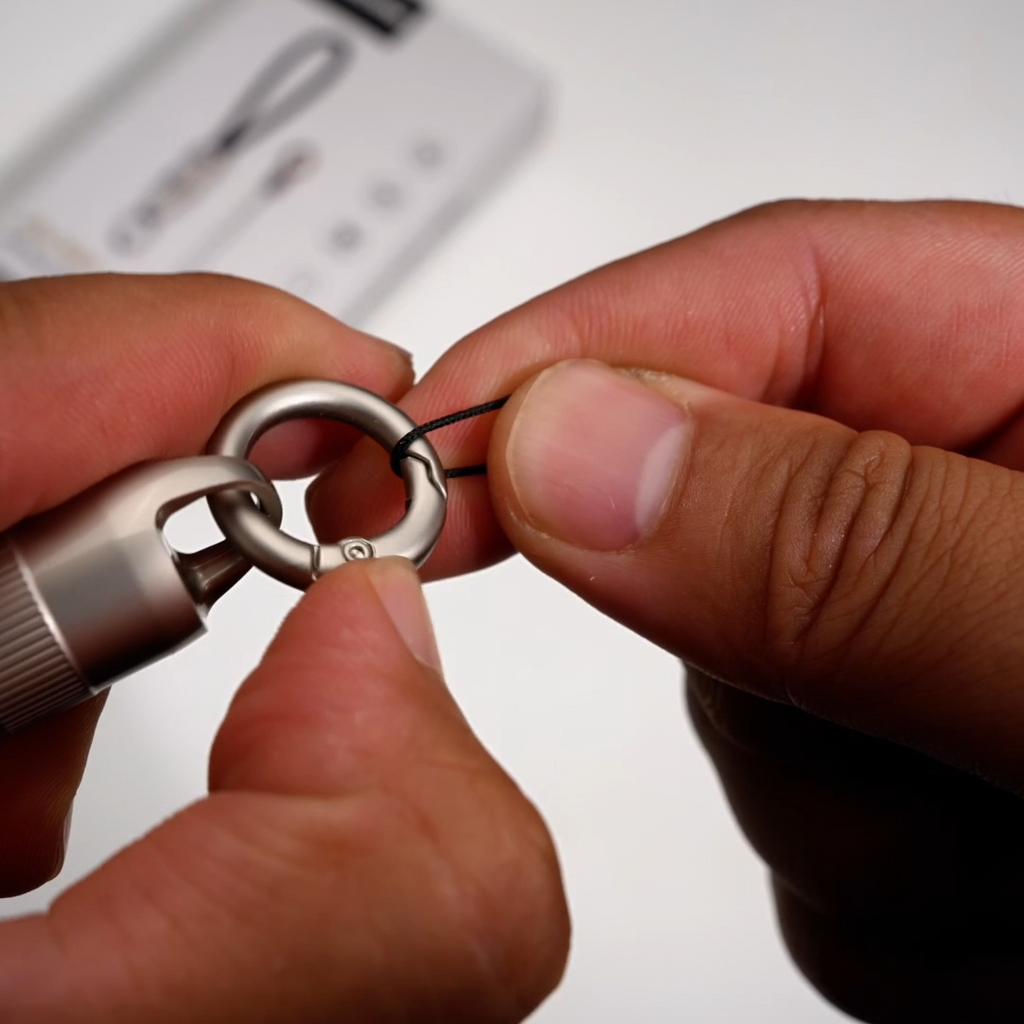 Closeup of attaching metal ring for Ultra Short Keychain Cable, detachable portable charging lanyard cable